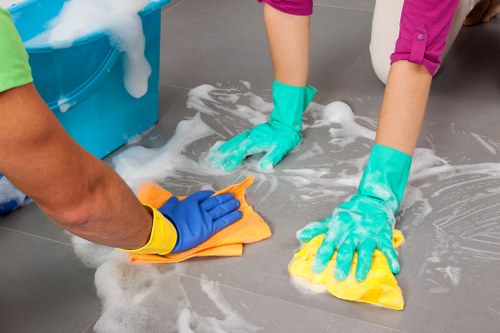 Cleaner tidying a home in Haringey